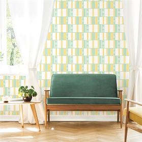 Real photo of a mid-century living room interior with a sofa, coffee table, windows and painting with retro geometric wallpaper in mint green and lime